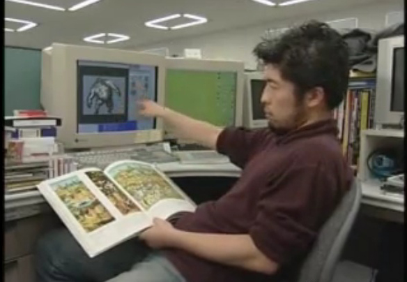 Masahiro Ito montre le livre de Bosch.